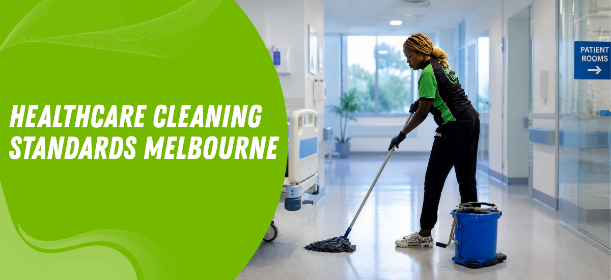Hospital cleaner mops a bright hallway while wearing a green-and-black uniform; blue 'Patient Rooms' sign visible in the doorway.