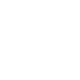 Person lying in a hospital bed with pillow and blanket.